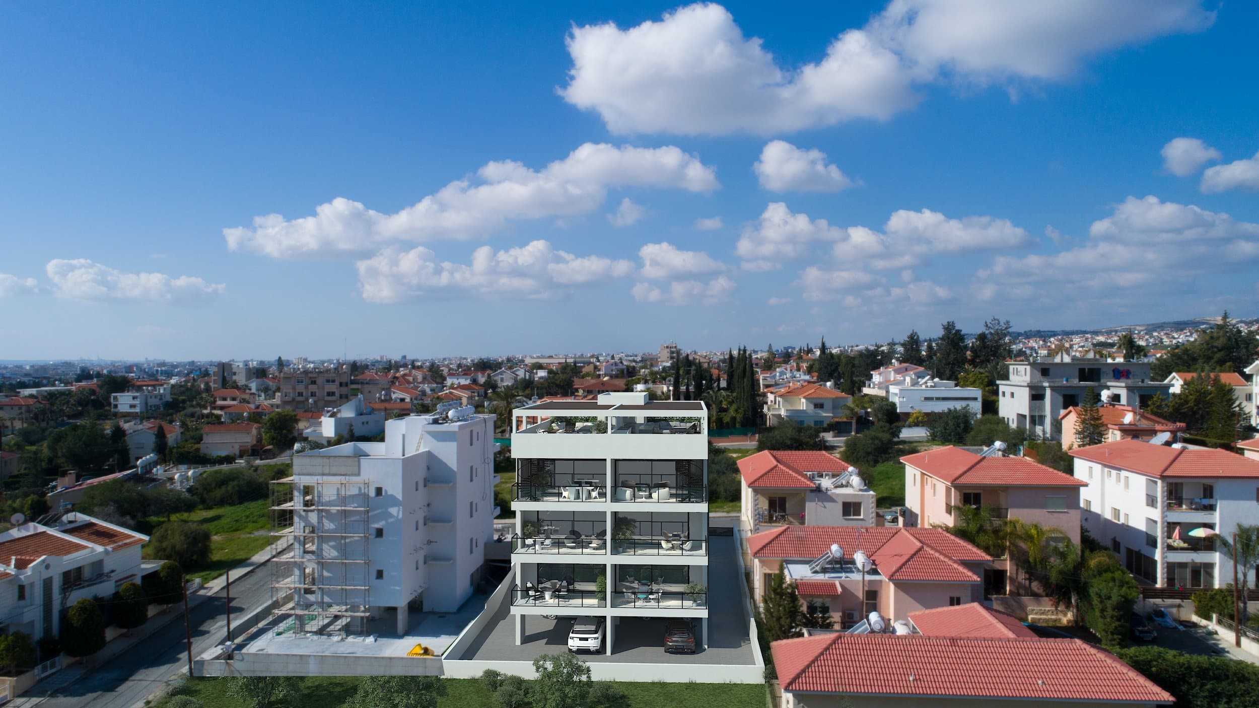 The completed Simplicity 1 residence from the air, the sea behind